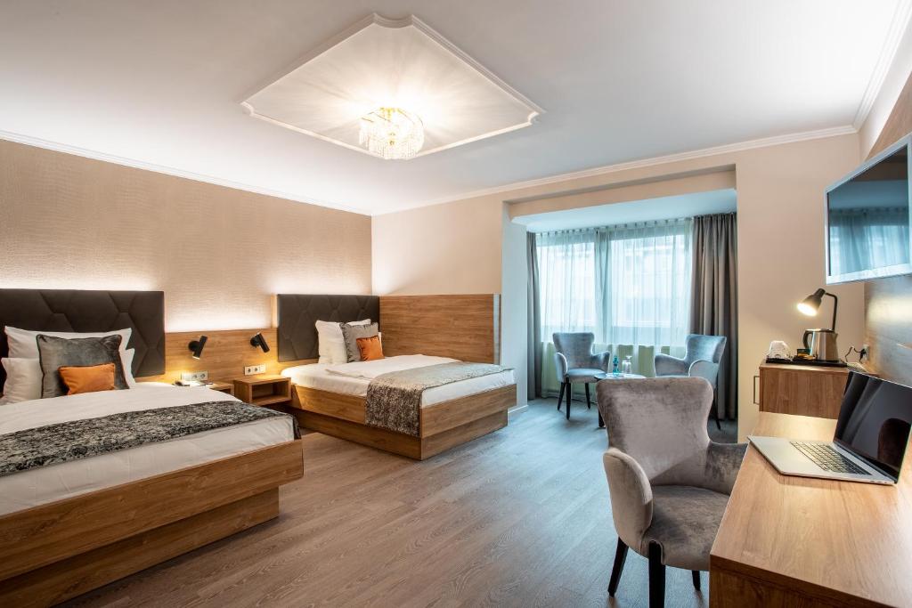 Cama ou camas em um quarto em Villa Westend Hotel an der Messe
