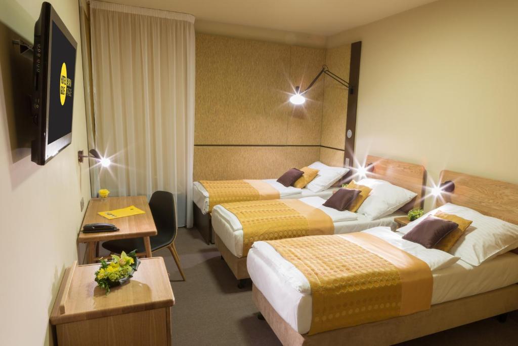 Tempat tidur dalam kamar di Hotel Golf Depandance