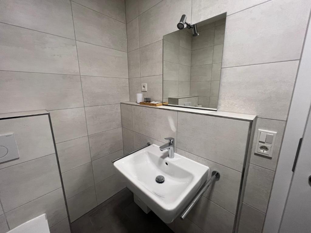 Koupelna v ubytování Hotel am Rathaus Adii