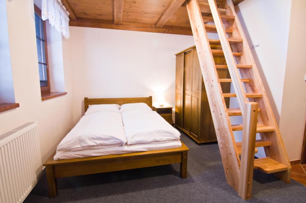 Łóżko lub łóżka w pokoju w obiekcie Apartmány Udatný