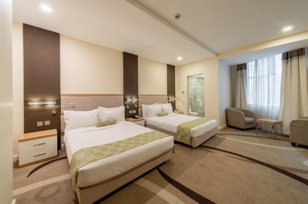 Postel nebo postele na pokoji v ubytování PrideInn Azure Hotel Nairobi Westlands
