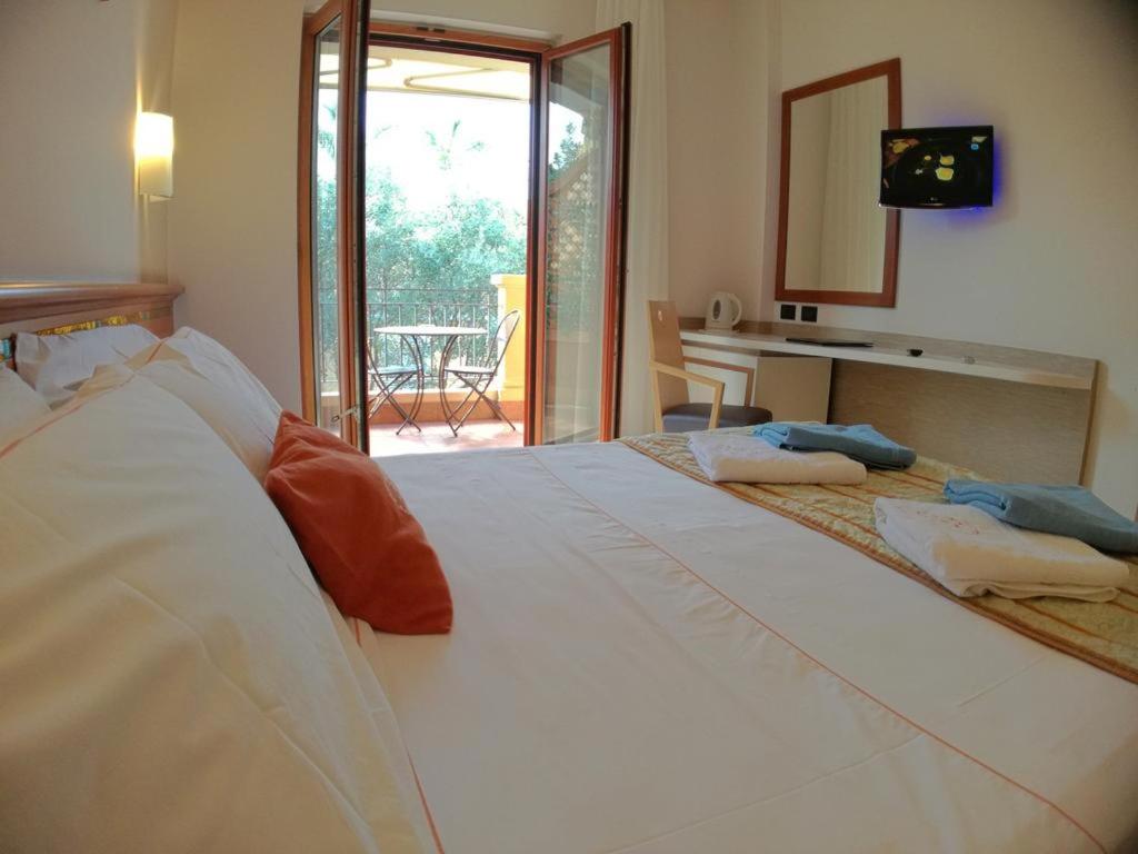 Postel nebo postele na pokoji v ubytování Hotel Residence Piccolo
