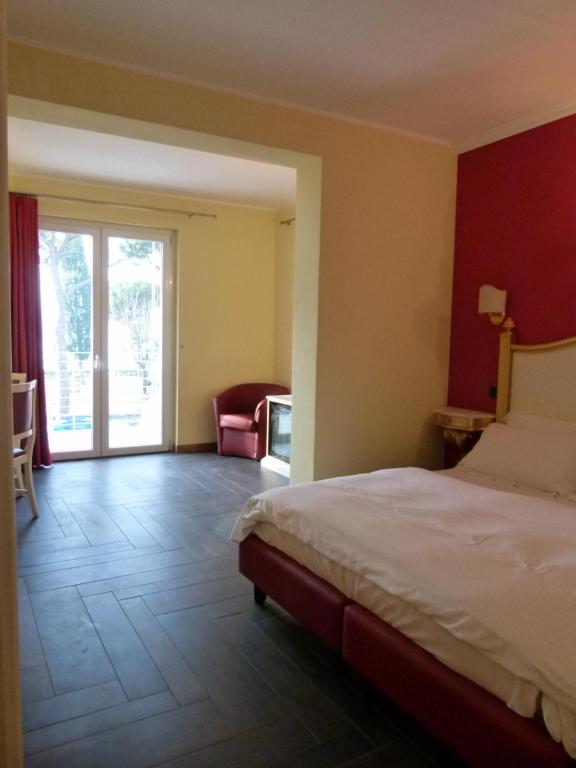Postel nebo postele na pokoji v ubytování Boutique Hotel Bel Sito Wellness & Private SPA