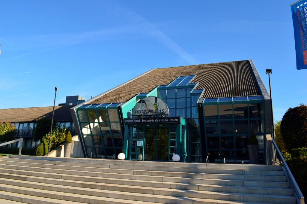 a building with stairs in front of a building at Best Western Hotel Nobis Eindhoven-Venlo A67 in Asten