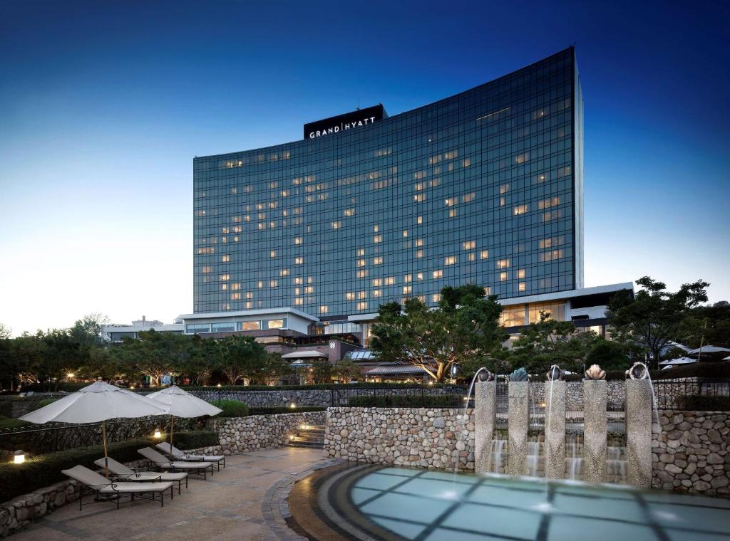 a building with a pool in front of a building at Grand Hyatt Seoul in Seoul