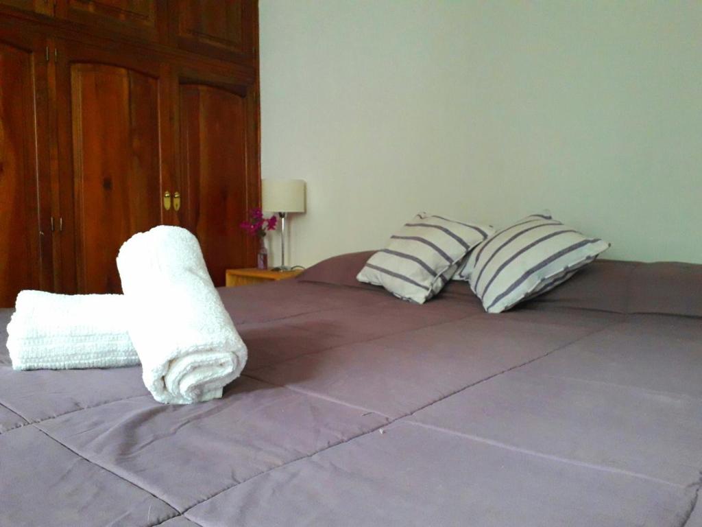 Postel nebo postele na pokoji v ubytování Tanino Guest House