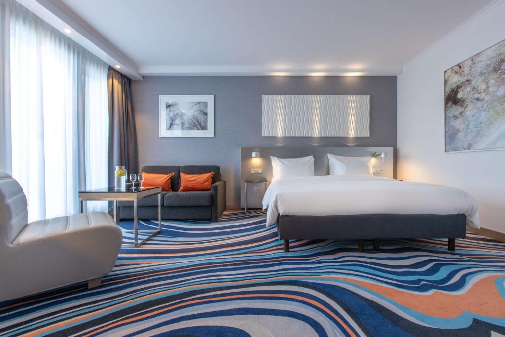 Postel nebo postele na pokoji v ubytování Radisson Blu Hotel Hannover