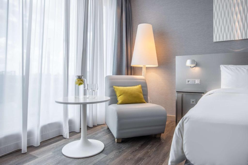 Postel nebo postele na pokoji v ubytování Radisson Blu Hotel Hannover