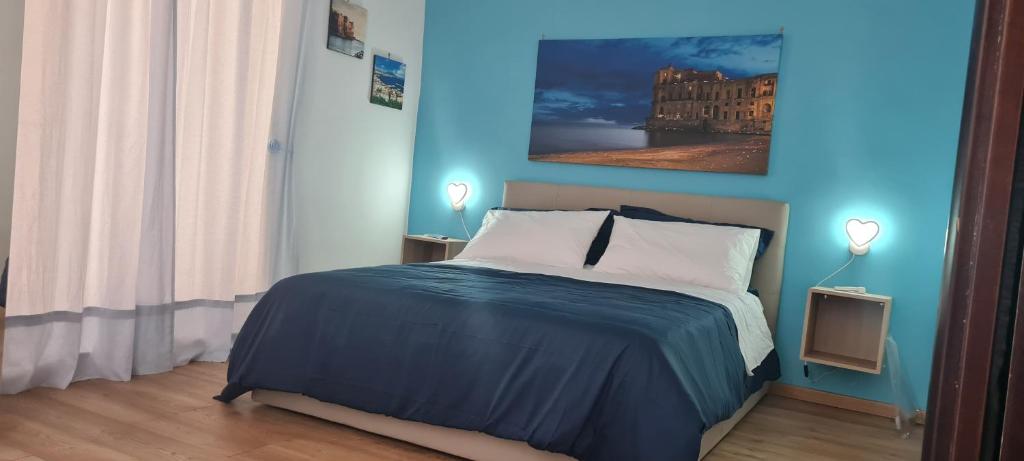 A bed or beds in a room at Napoli Blu Gardenia B&B