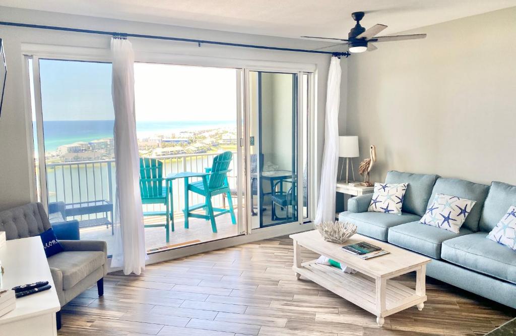 a living room with a couch and a view of the ocean at 122 Seascape Dr Unit 1406 in Destin