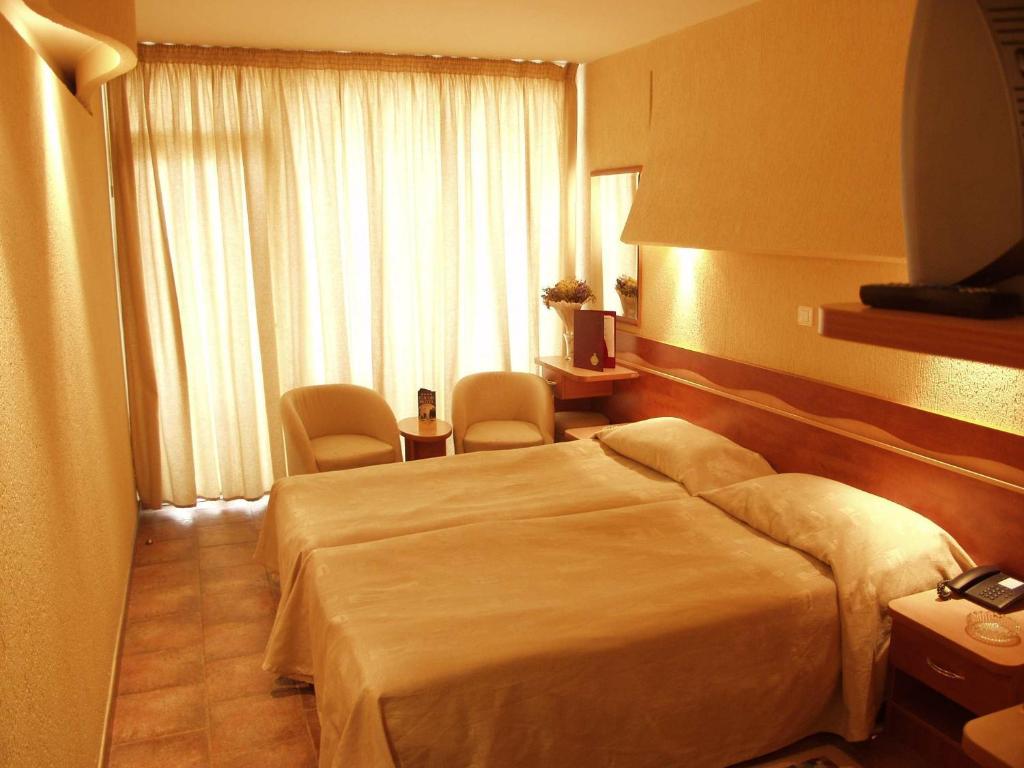 Postel nebo postele na pokoji v ubytování Cocor Spa Hotel