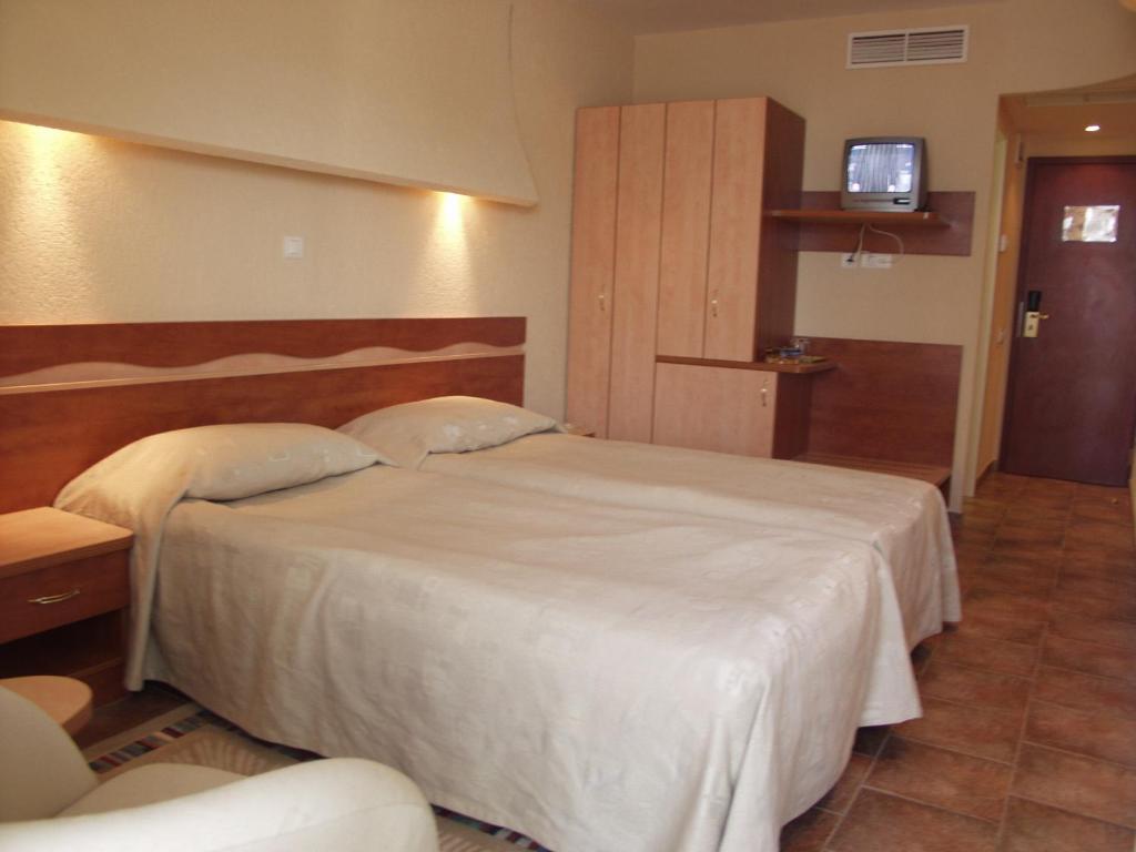 Postel nebo postele na pokoji v ubytování Cocor Spa Hotel