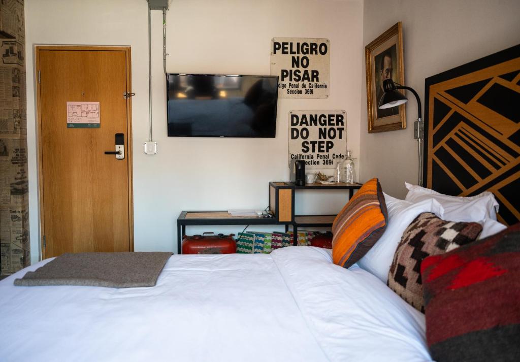 Postel nebo postele na pokoji v ubytování Hotel Boutique Lafayette Tijuana