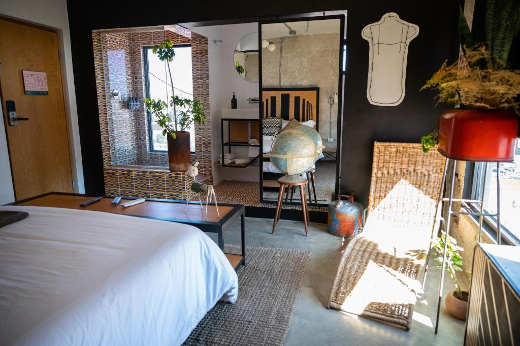 Postel nebo postele na pokoji v ubytování Hotel Boutique Lafayette Tijuana