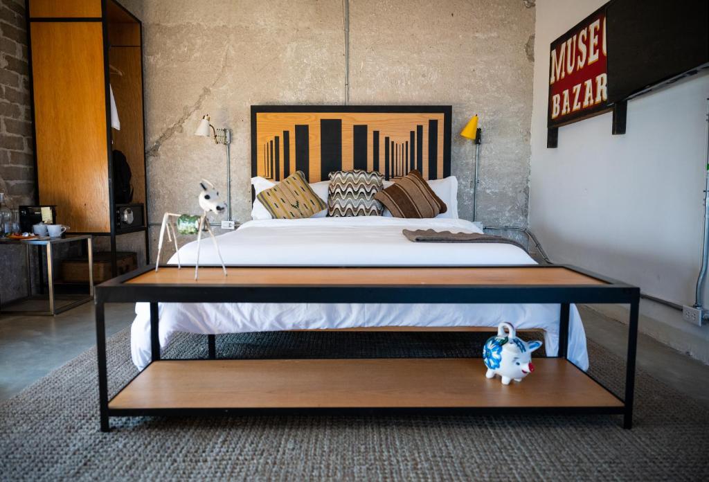 Postel nebo postele na pokoji v ubytování Hotel Boutique Lafayette Tijuana