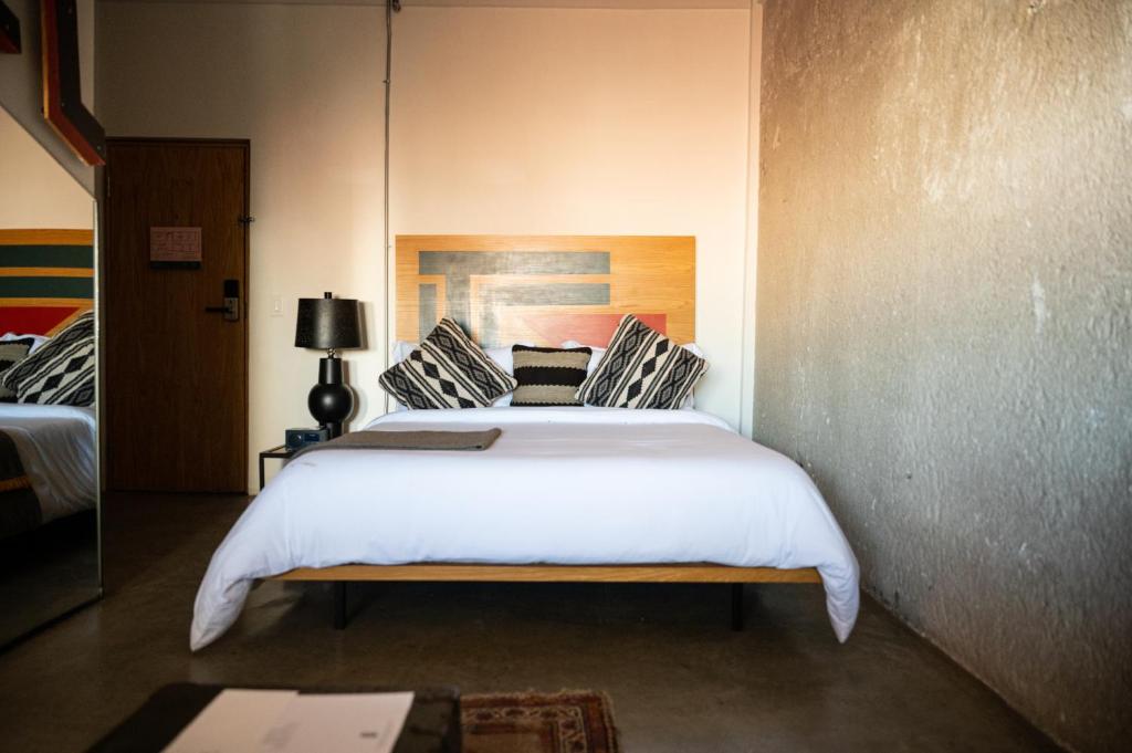 Postel nebo postele na pokoji v ubytování Hotel Boutique Lafayette Tijuana