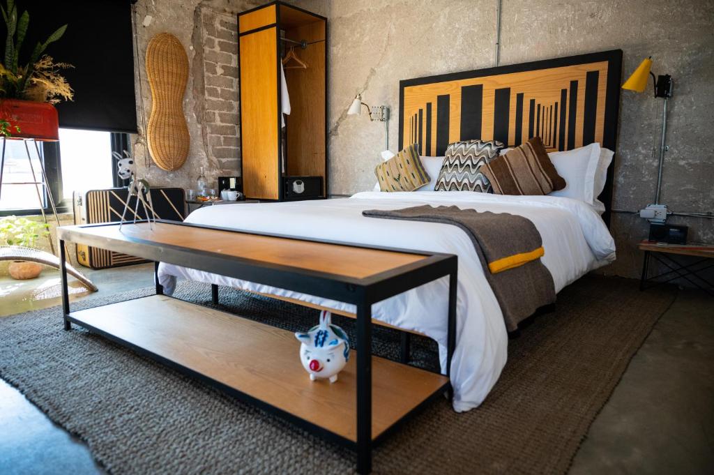 Postel nebo postele na pokoji v ubytování Hotel Boutique Lafayette Tijuana