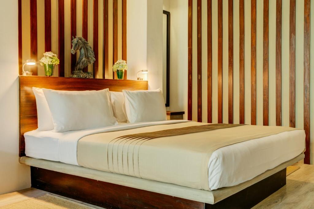 Postel nebo postele na pokoji v ubytování Nyne Hotels Lake Lodge, Colombo