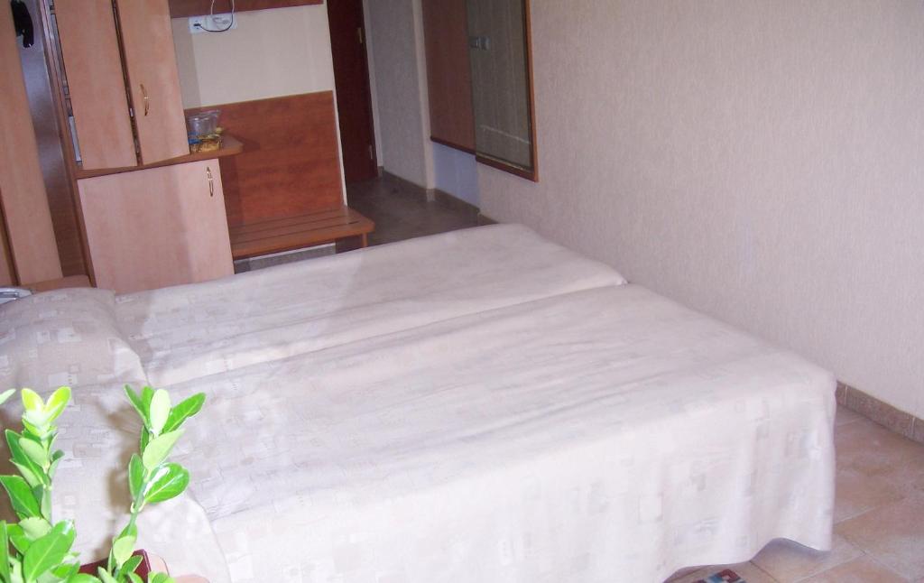Postel nebo postele na pokoji v ubytování Cocor Spa Hotel