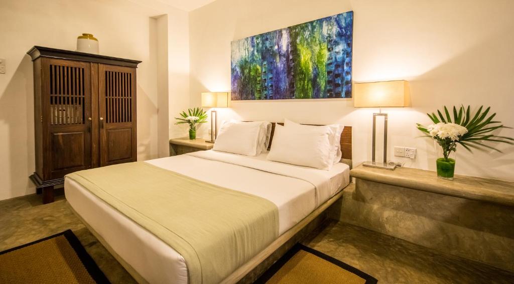 Postel nebo postele na pokoji v ubytování Nyne Hotels Lake Lodge, Colombo