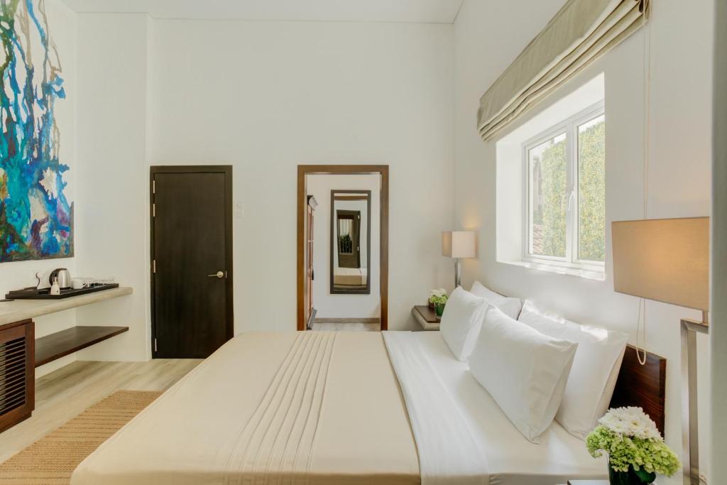 Postel nebo postele na pokoji v ubytování Nyne Hotels Lake Lodge, Colombo