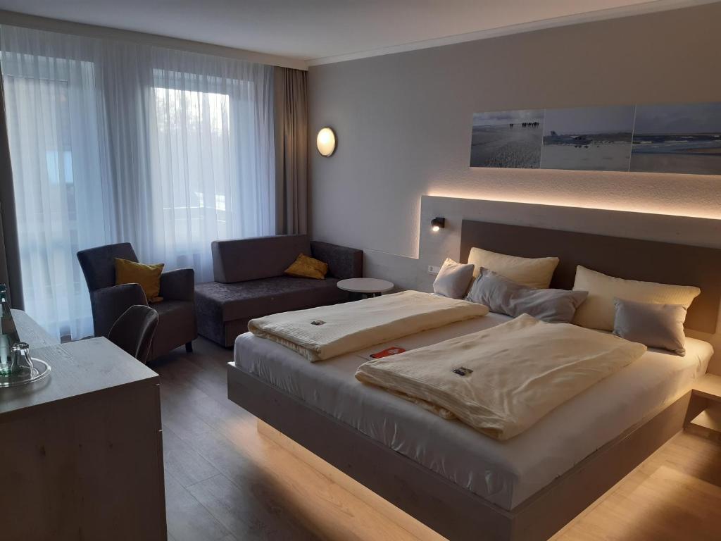 Postel nebo postele na pokoji v ubytování Apart Hotel Norden