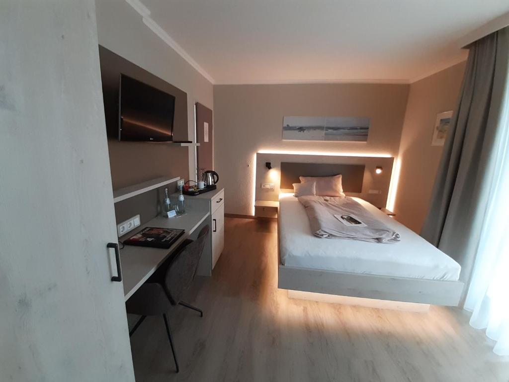 Postel nebo postele na pokoji v ubytování Apart Hotel Norden