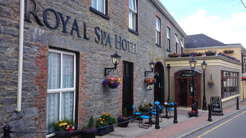 a building with a sign on the side of it at Royal Spa Hotel in Lisdoonvarna