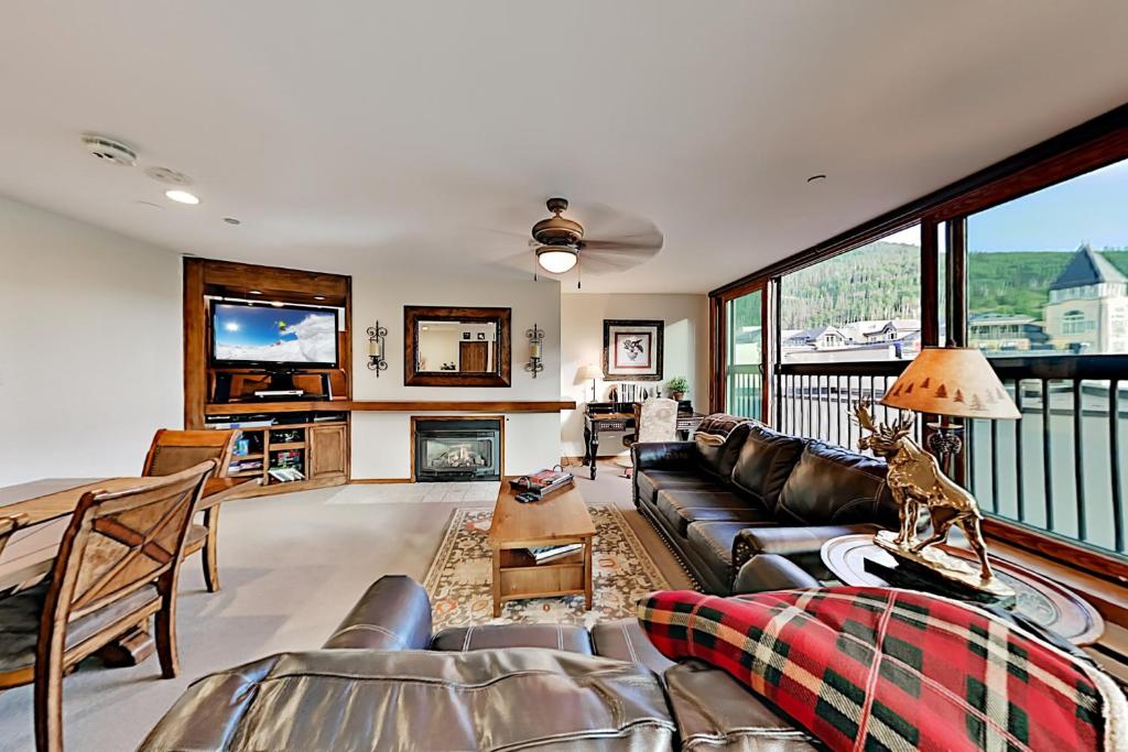 a living room with a couch and a fireplace at Vail Spa 301 in Vail