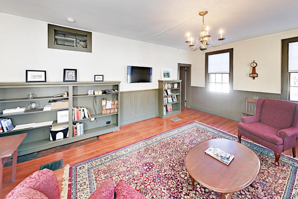 a living room with a couch and a table at Nickels-Sortwell House in Wiscasset