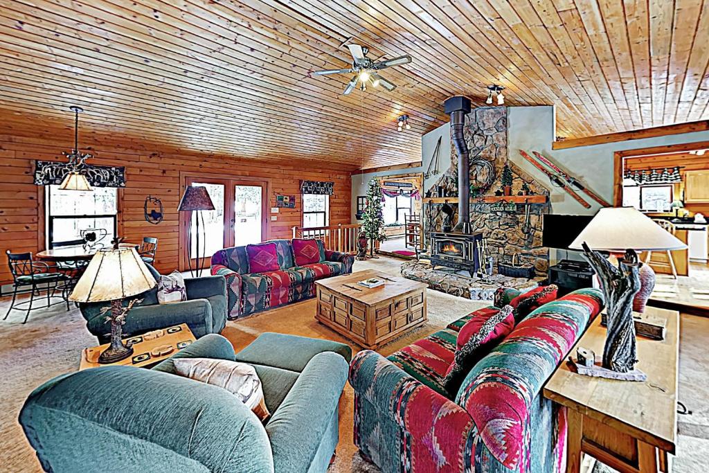 a living room with a couch and a fireplace at The Breck House in Breckenridge