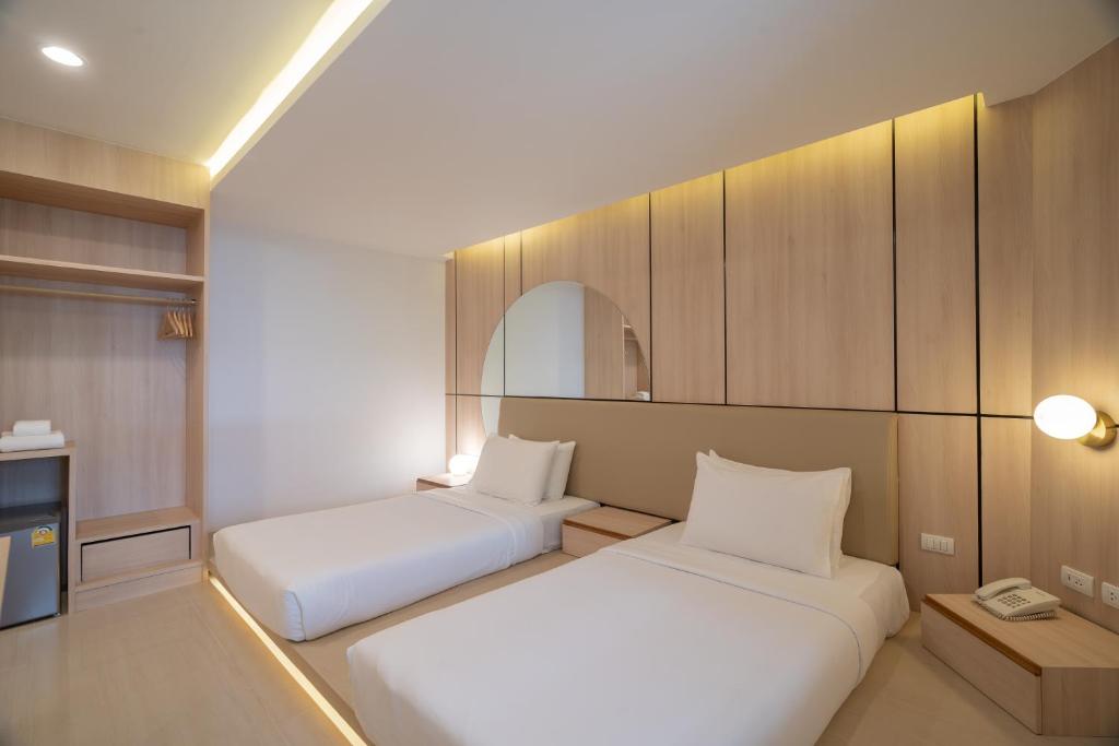 Postel nebo postele na pokoji v ubytování Bedline Hotel - SHA Certified
