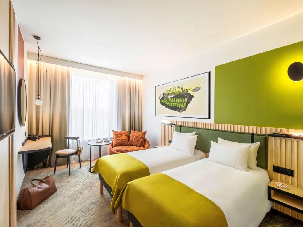 Posteľ alebo postele v izbe v ubytovaní Mercure Katowice Centrum