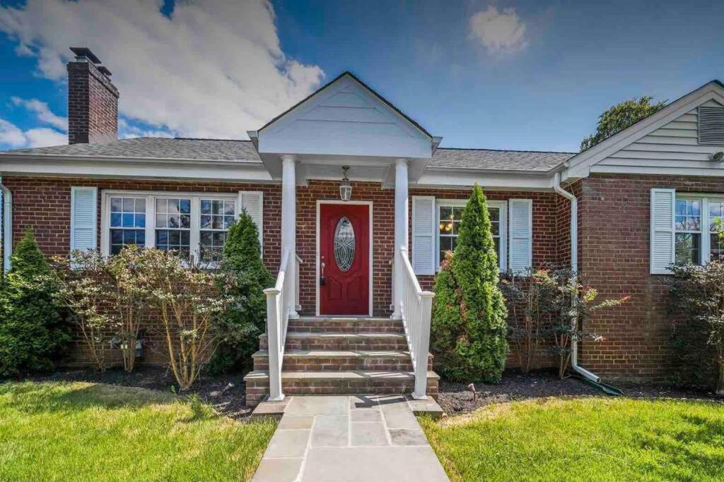 a red brick house with a red door at Arlington, VA for Lovers and Friends in Arlington