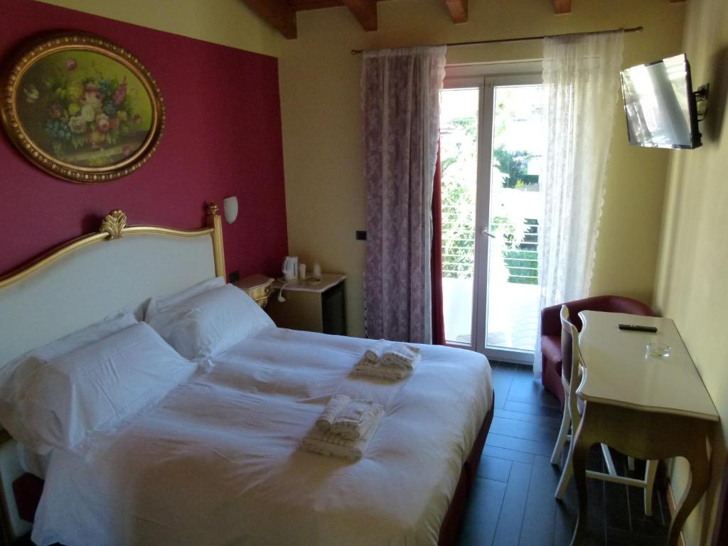 Postel nebo postele na pokoji v ubytování Boutique Hotel Bel Sito Wellness & Private SPA
