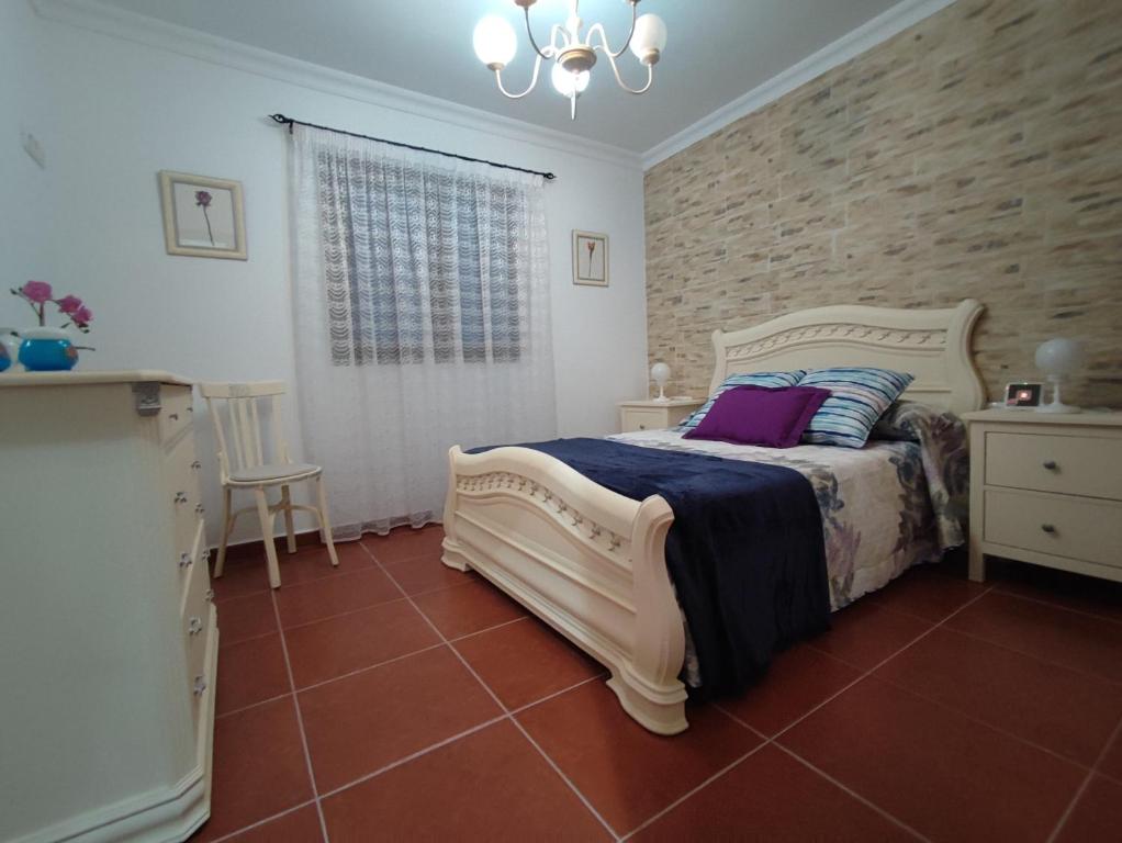 Postel nebo postele na pokoji v ubytování Villa Rosa