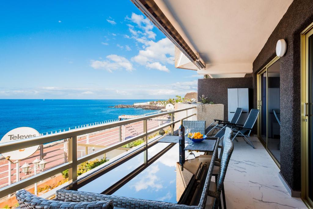 a balcony with a view of the ocean at CASA NELKA in Puerto de Santiago