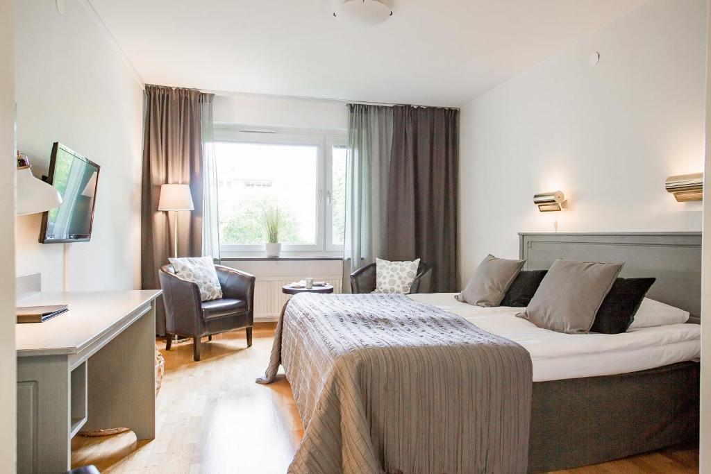 Postel nebo postele na pokoji v ubytování Duvan Hotell & Konferens