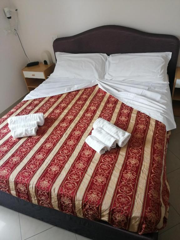 Postel nebo postele na pokoji v ubytování Hotel Riposo