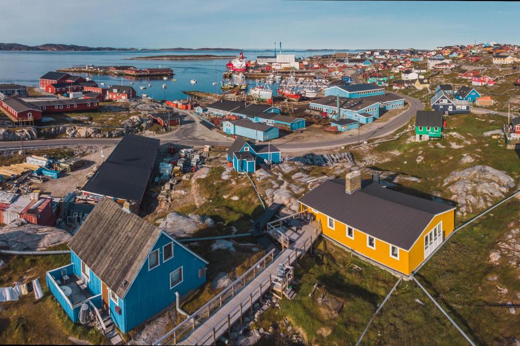 an aerial view of a small town with a harbor at Hope Hostel in Aasiaat