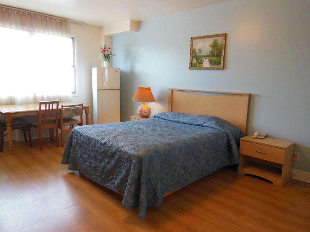 Postel nebo postele na pokoji v ubytování Motel Pierre