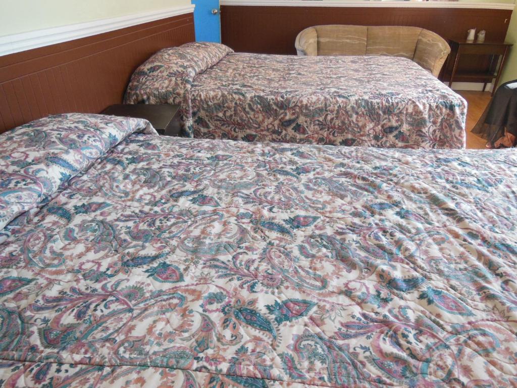 Postel nebo postele na pokoji v ubytování Motel Pierre