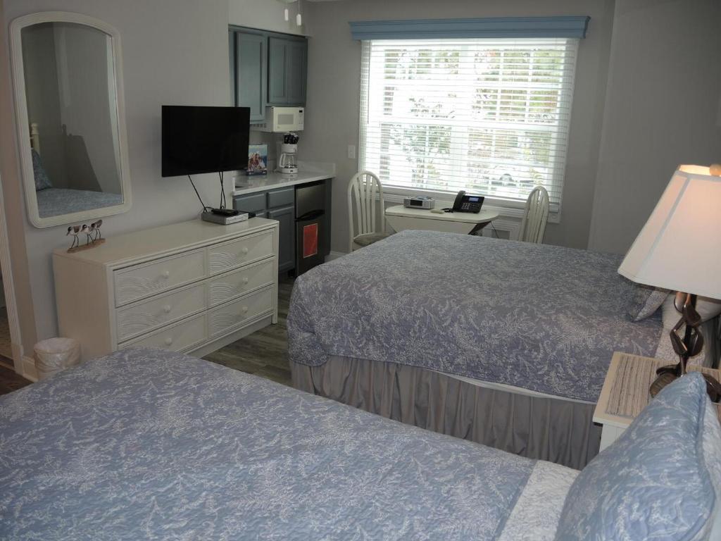 Ένα ή περισσότερα κρεβάτια σε δωμάτιο στο Studio Style Home 308L features Golf