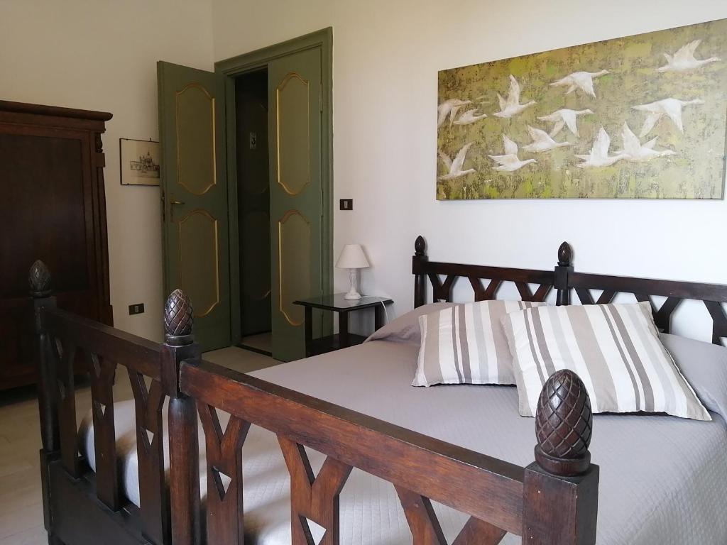 Postel nebo postele na pokoji v ubytování Vigna dell'Agrifoglio - Bed and Breakfast
