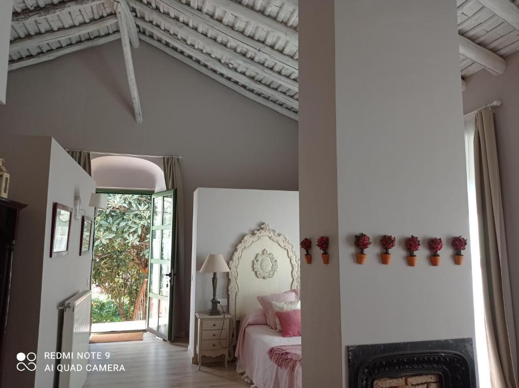 Posteľ alebo postele v izbe v ubytovaní Finca La Favorita- Suites
