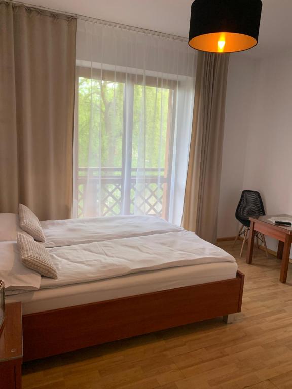Posteľ alebo postele v izbe v ubytovaní Przystanek Gubałówka -Guest House Zakopane
