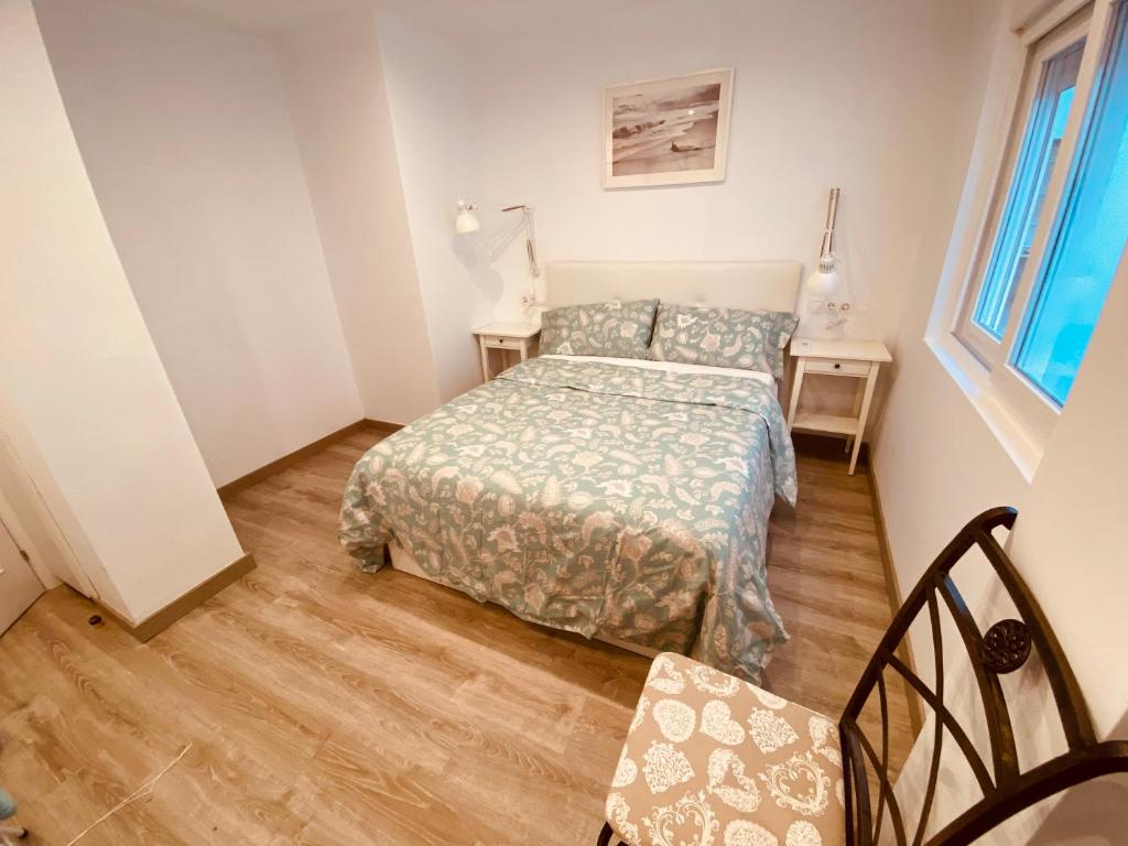 A bed or beds in a room at Nuestro Rinconcito del Soho
