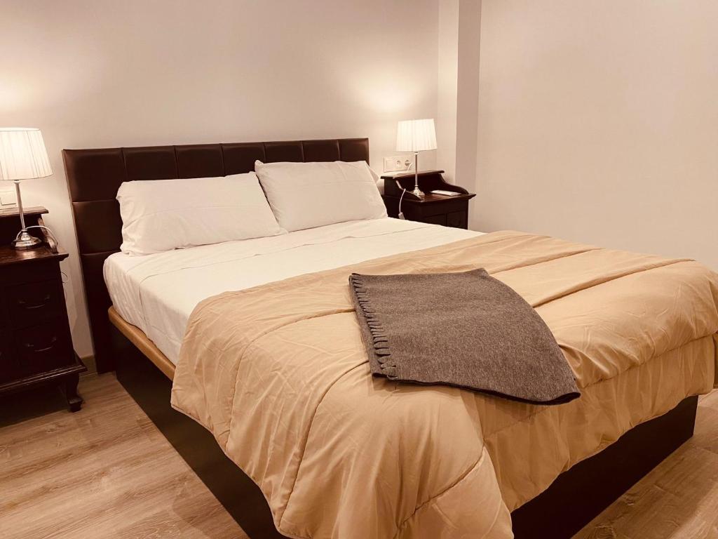 A bed or beds in a room at Nuestro Rinconcito del Soho