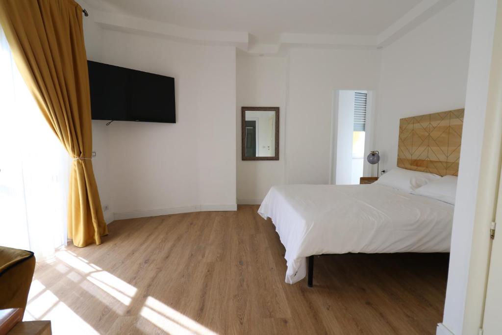 TV a/nebo společenská místnost v ubytování Domino Hotel