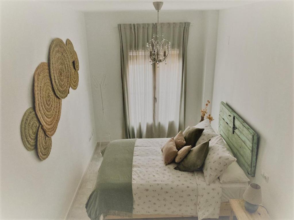 Postel nebo postele na pokoji v ubytování El Envero Apartamento